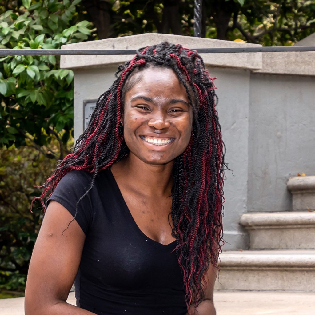 image of young african american woman in black shirt smiling