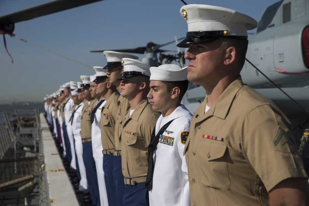 Marines and Sailors man the rails as the San Antonio-class amphibious transport dock ship USS New York