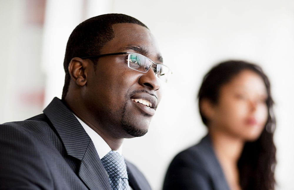 man with glasses and business attire