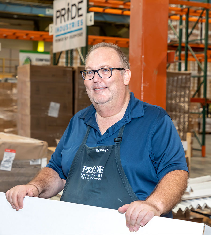 image of caucasian man in glasses and black apron in food packaging warehouse