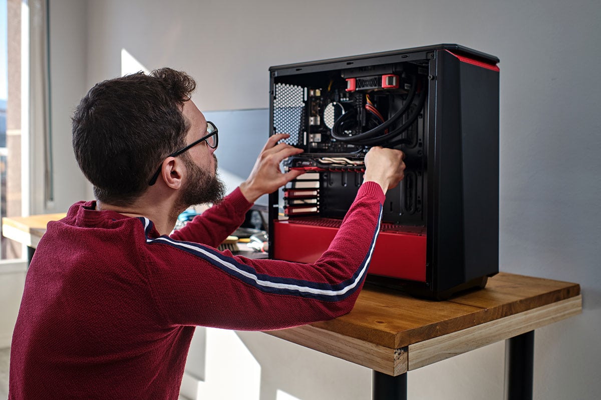man fixing electronics