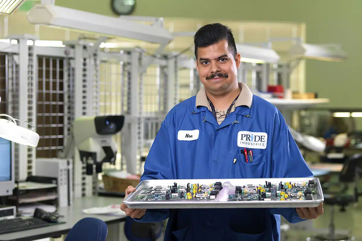 PRIDE Industries worker in electronics