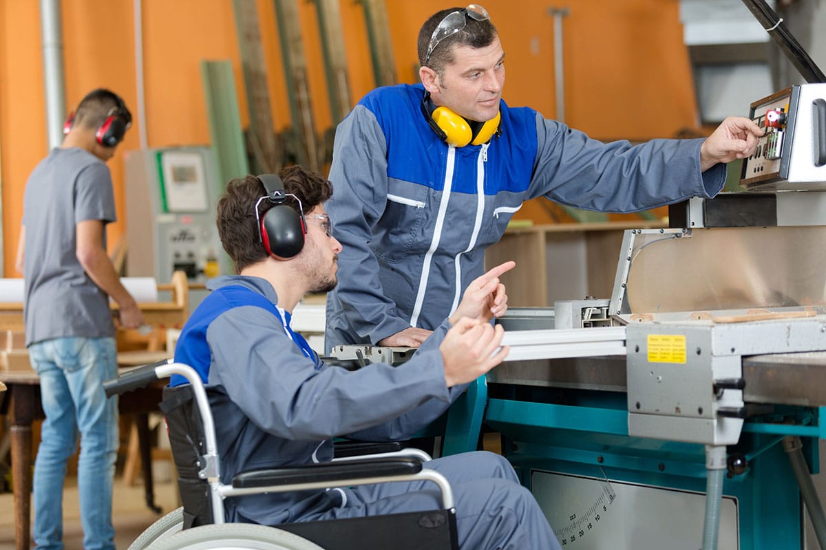A factory floor worker with a disability.