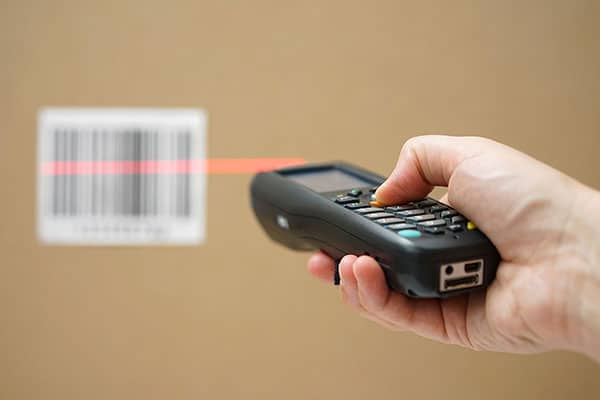 worker holding scanner tool