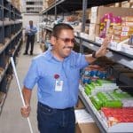 Ray Muro using braille system he designed