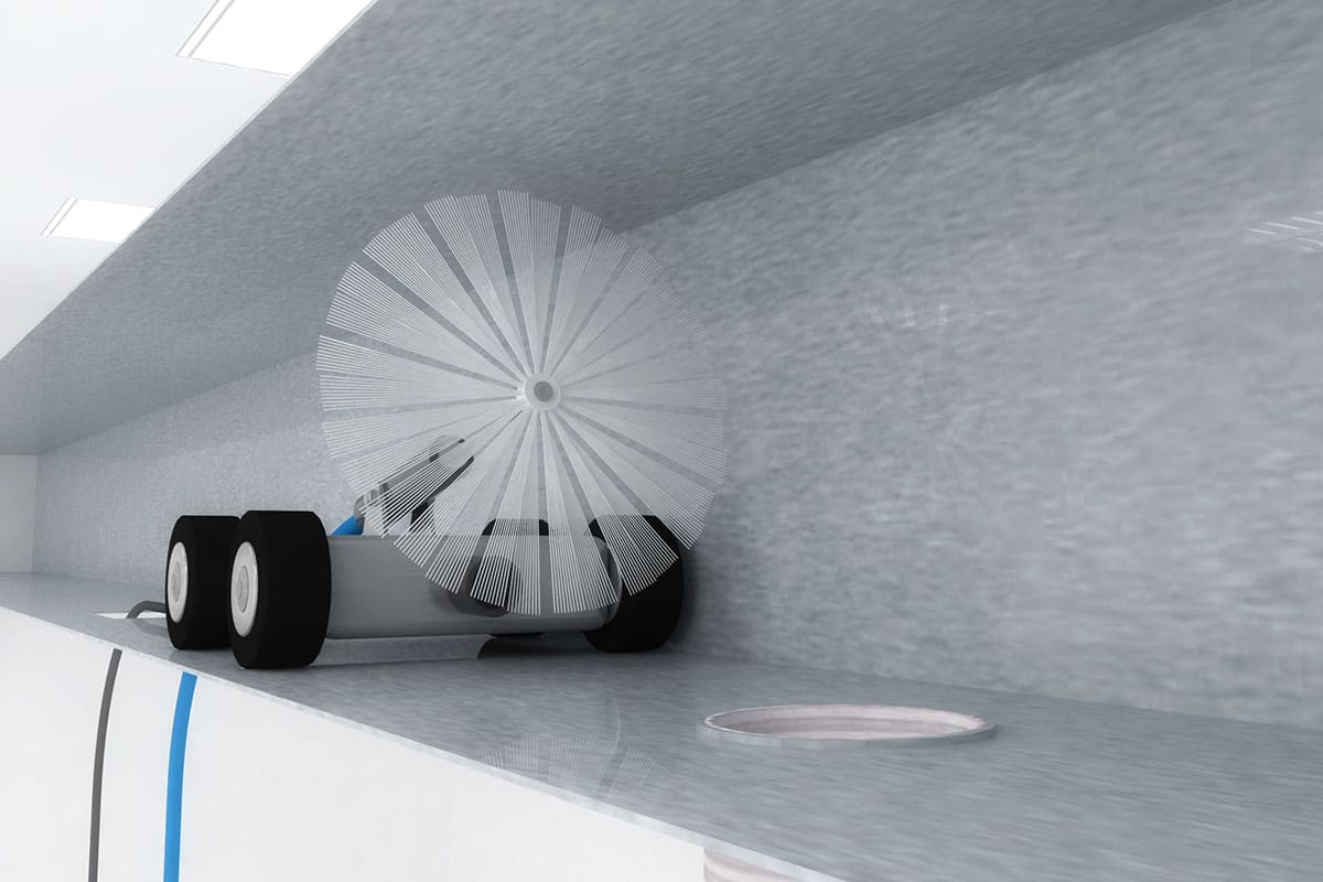 A close-up of a duct-cleaning robot as it travels through an air duct