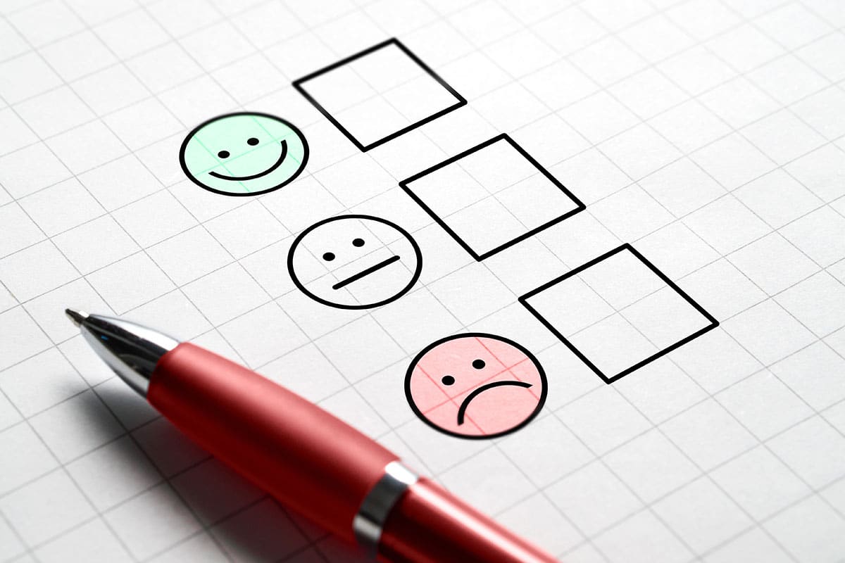 paper with three boxes indicating level of satisfaction.