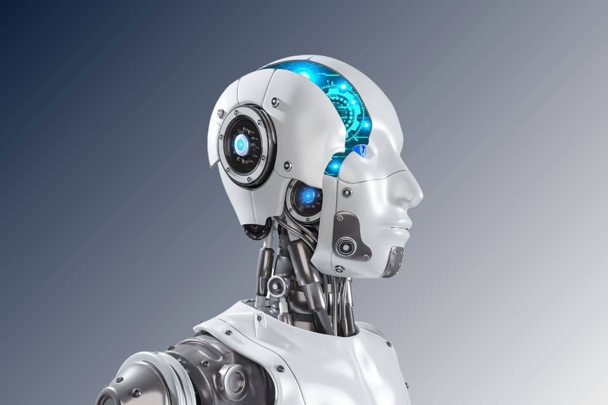 The head and shoulders of a humanoid robot with a metal-and-silicone face